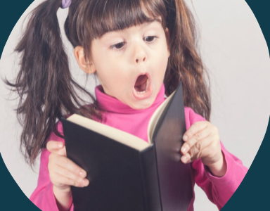 Young girl reading a book with a surprised look on her face.