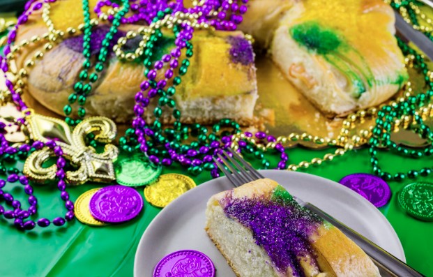 King's Cake with purple, green and gold beads.