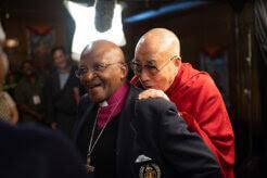 a photo of the Dalai Lama jembracing Desmond Tutu