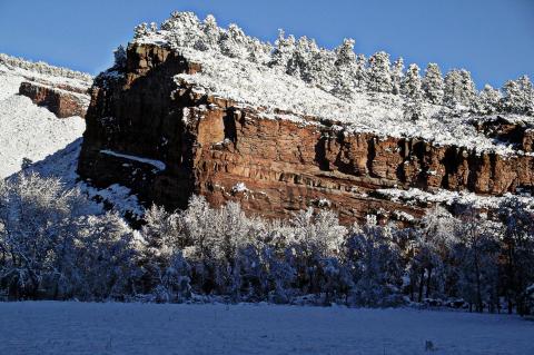 A photograph of Hall Ranch dusted with light snow against a blue sky