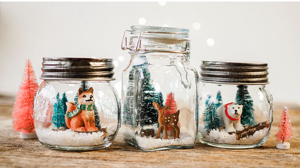 mason jar snow globes with animals and trees inside